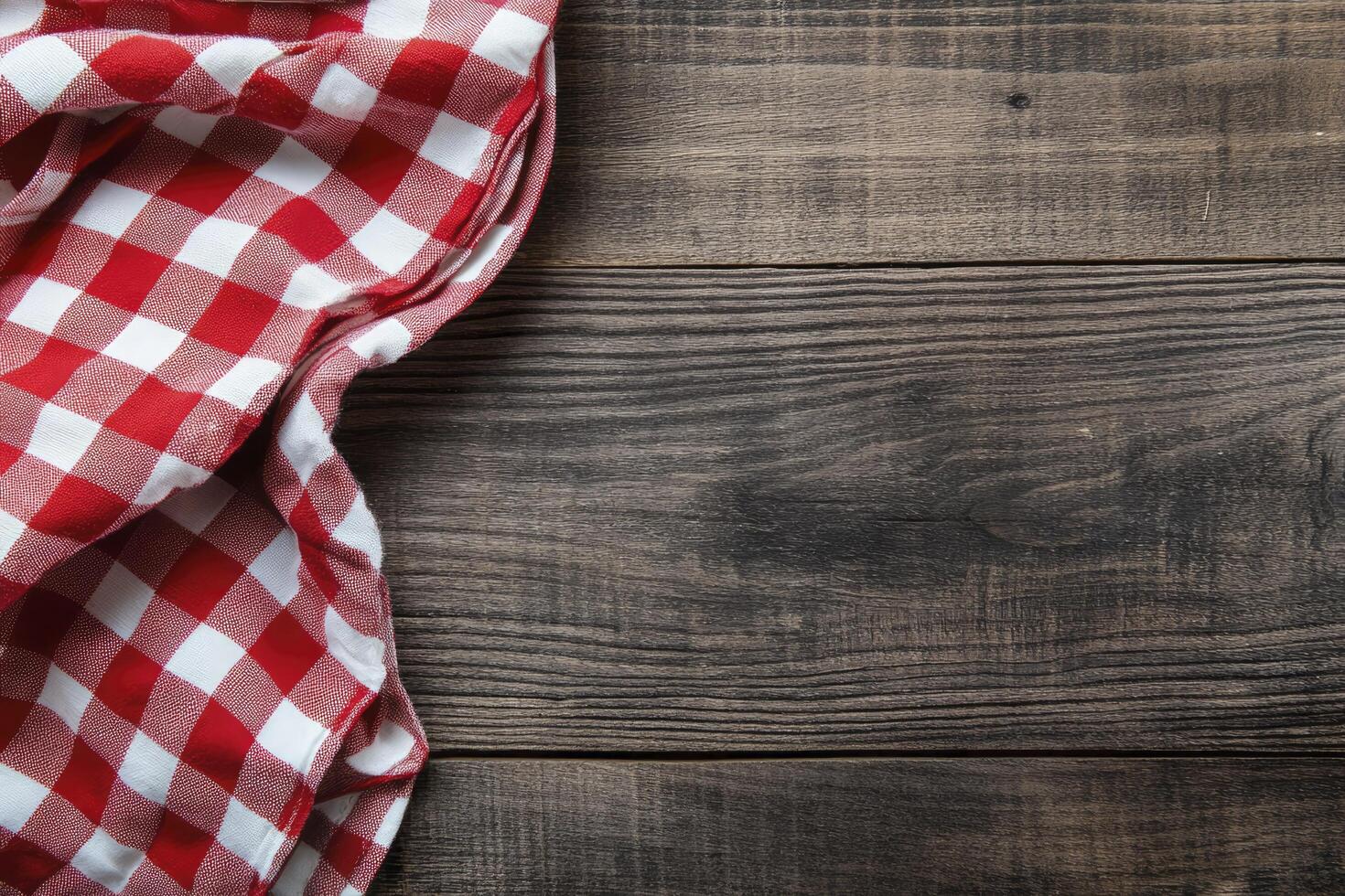 A red and white checkered cloth on a wooden table photo