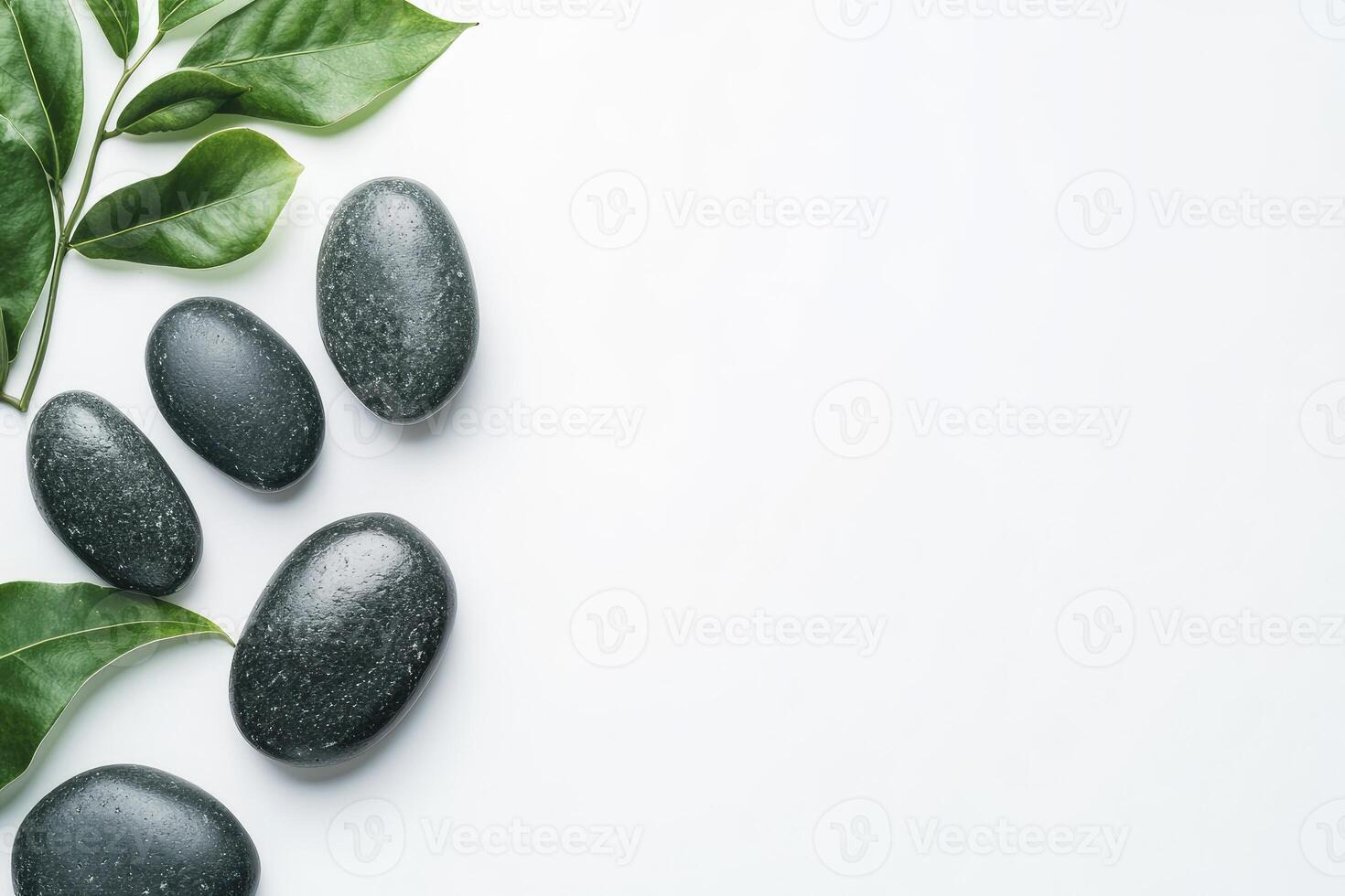 Spa stones and leaves on white background photo