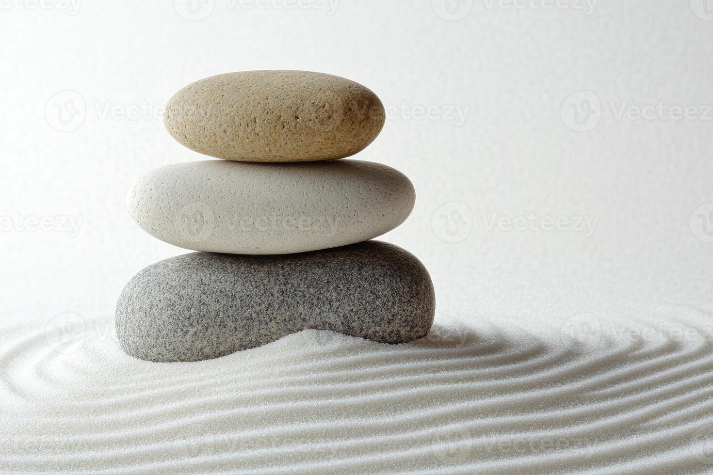 A stack of stones on a white surface photo