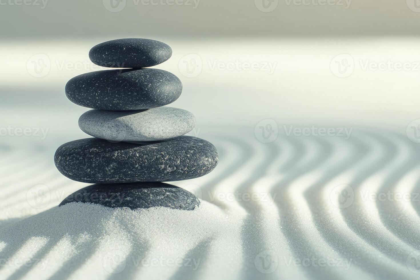 A stack of rocks in the sand photo