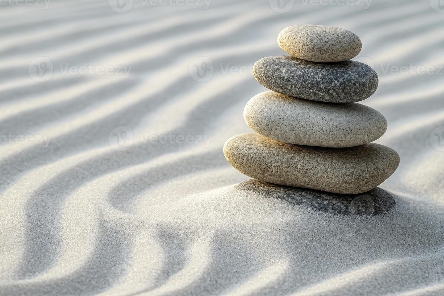 A stack of stones in the sand photo