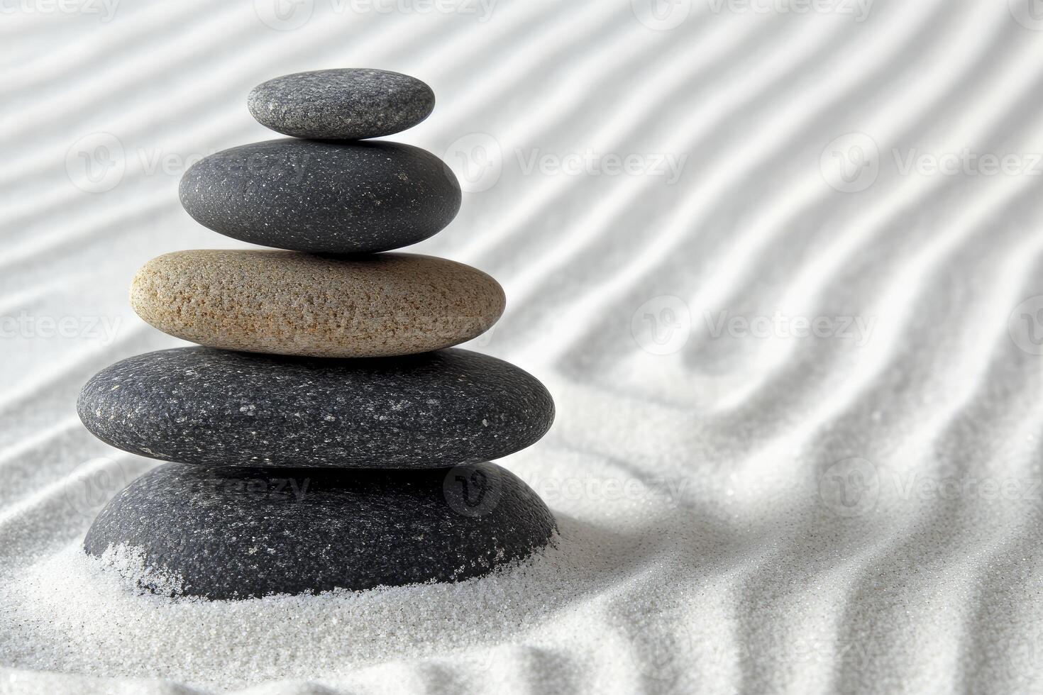 A stack of rocks in the sand photo