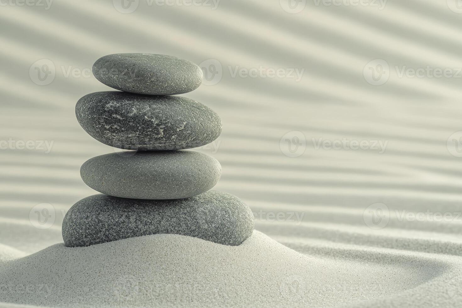 A stack of stones in the sand photo