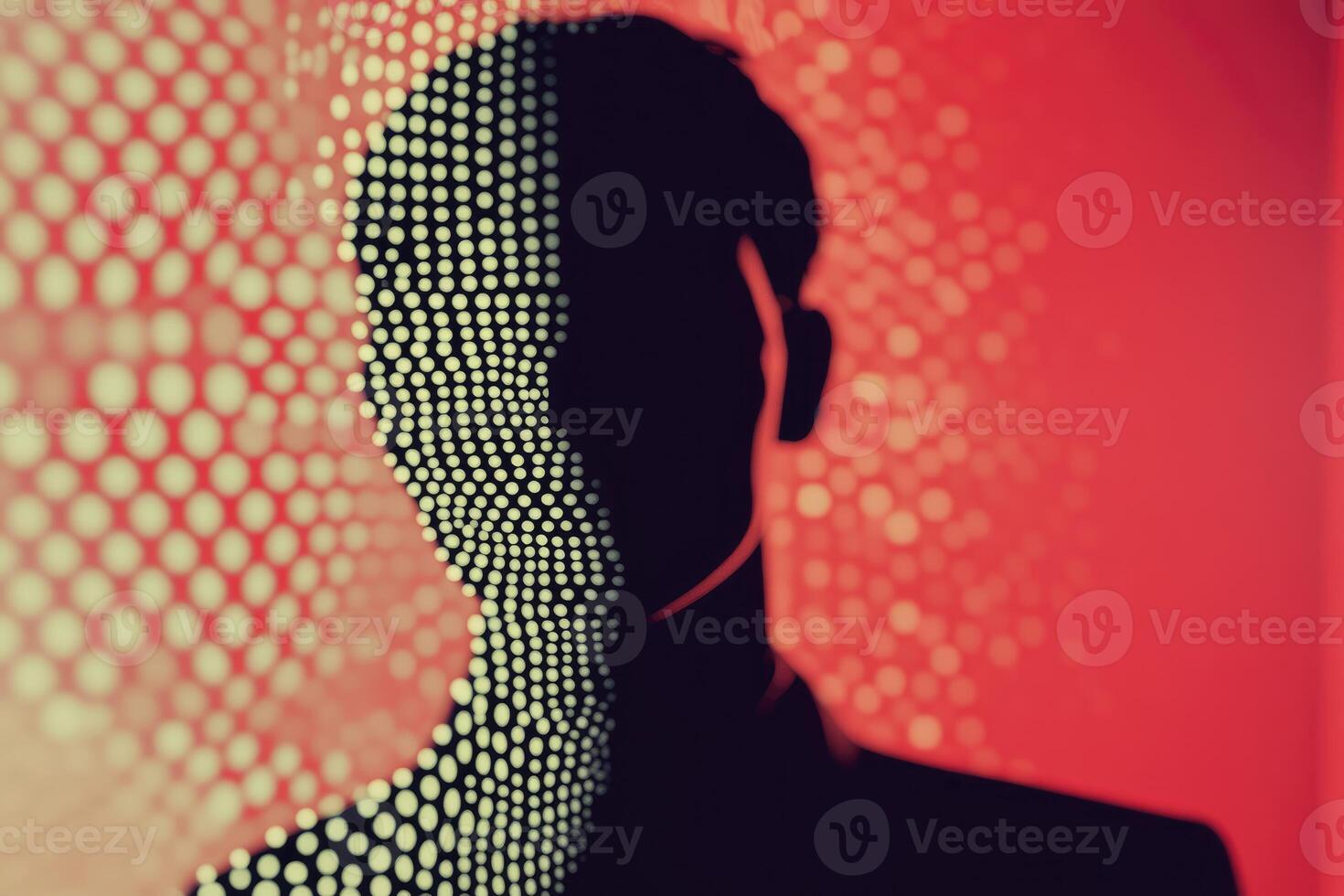 A man's silhouette is shown against a red background photo