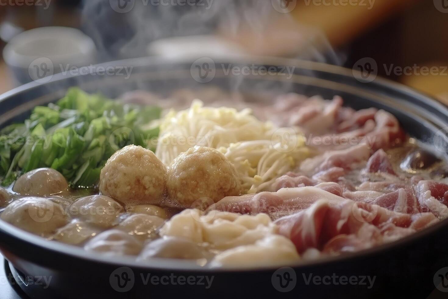 A pot filled with meat and vegetables on a stove photo