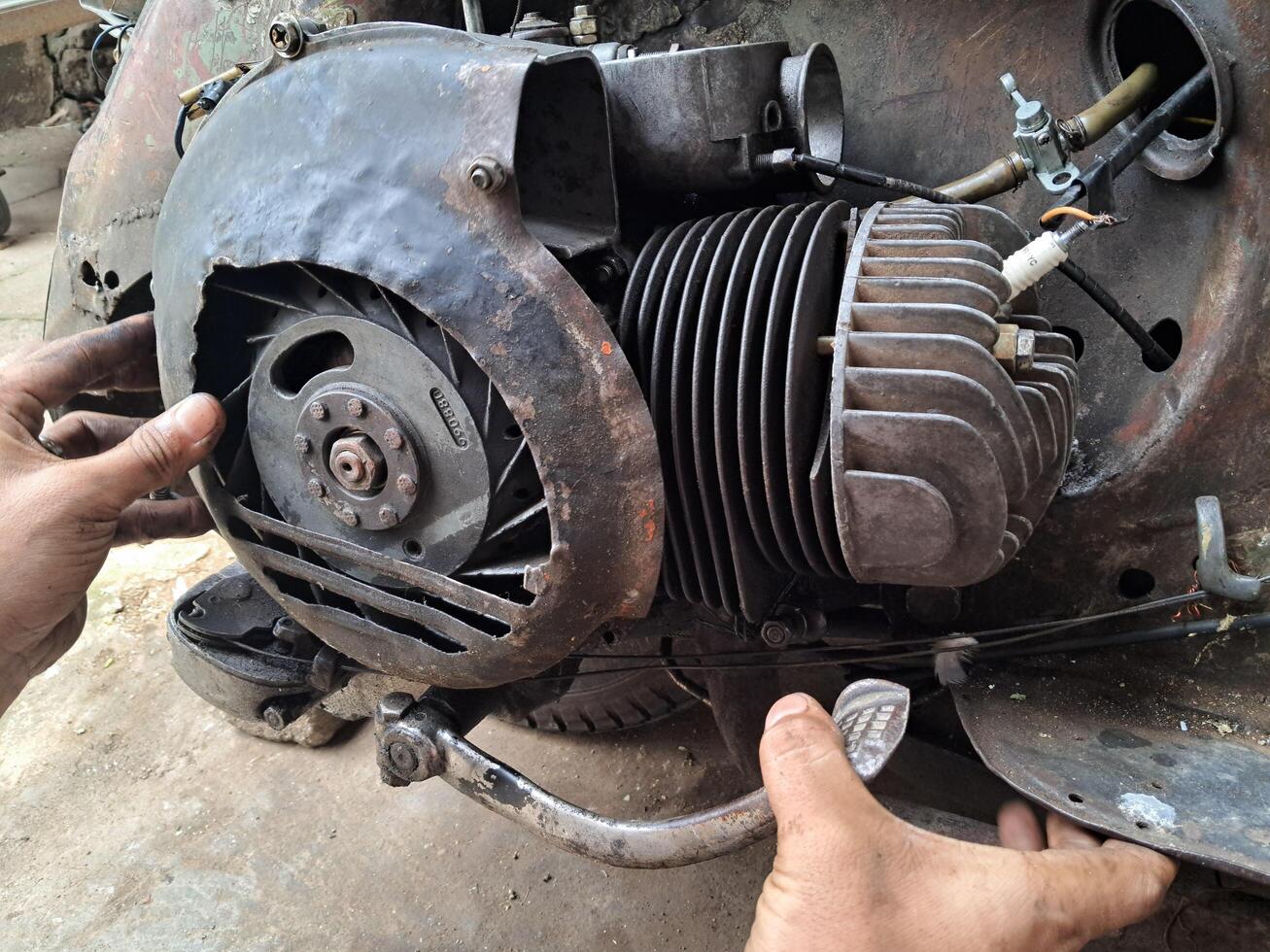 Old Vespa engine being repaired photo