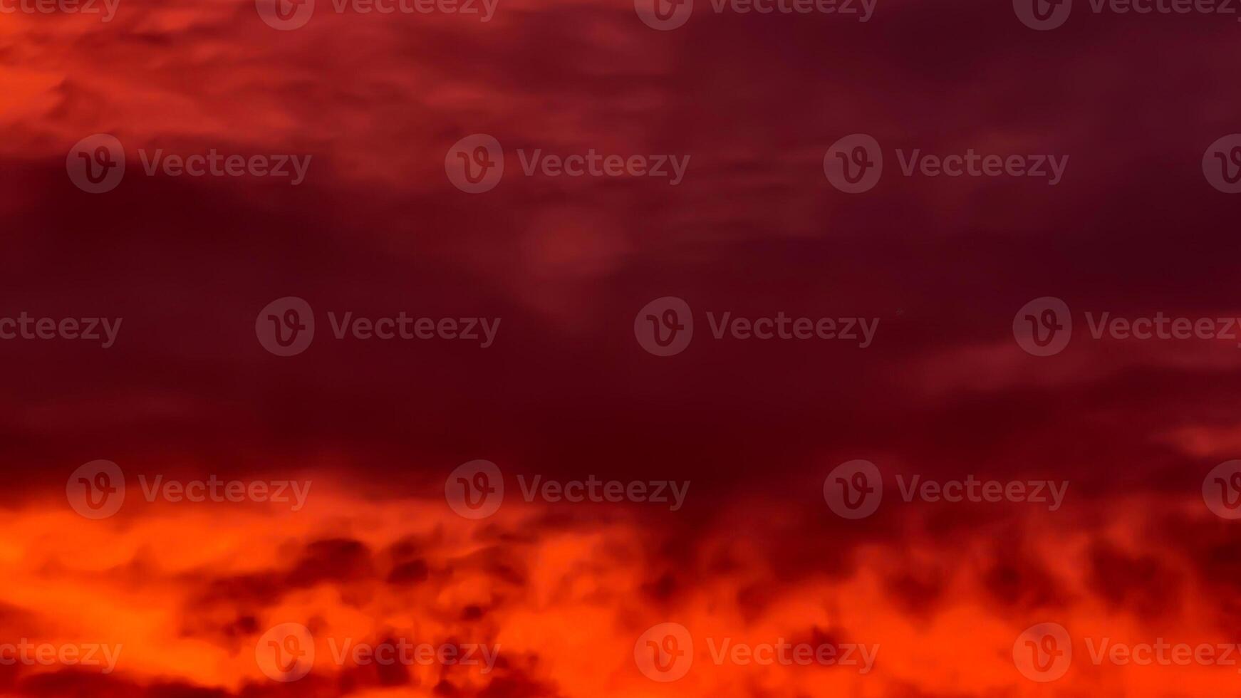 A red and orange sky with clouds photo