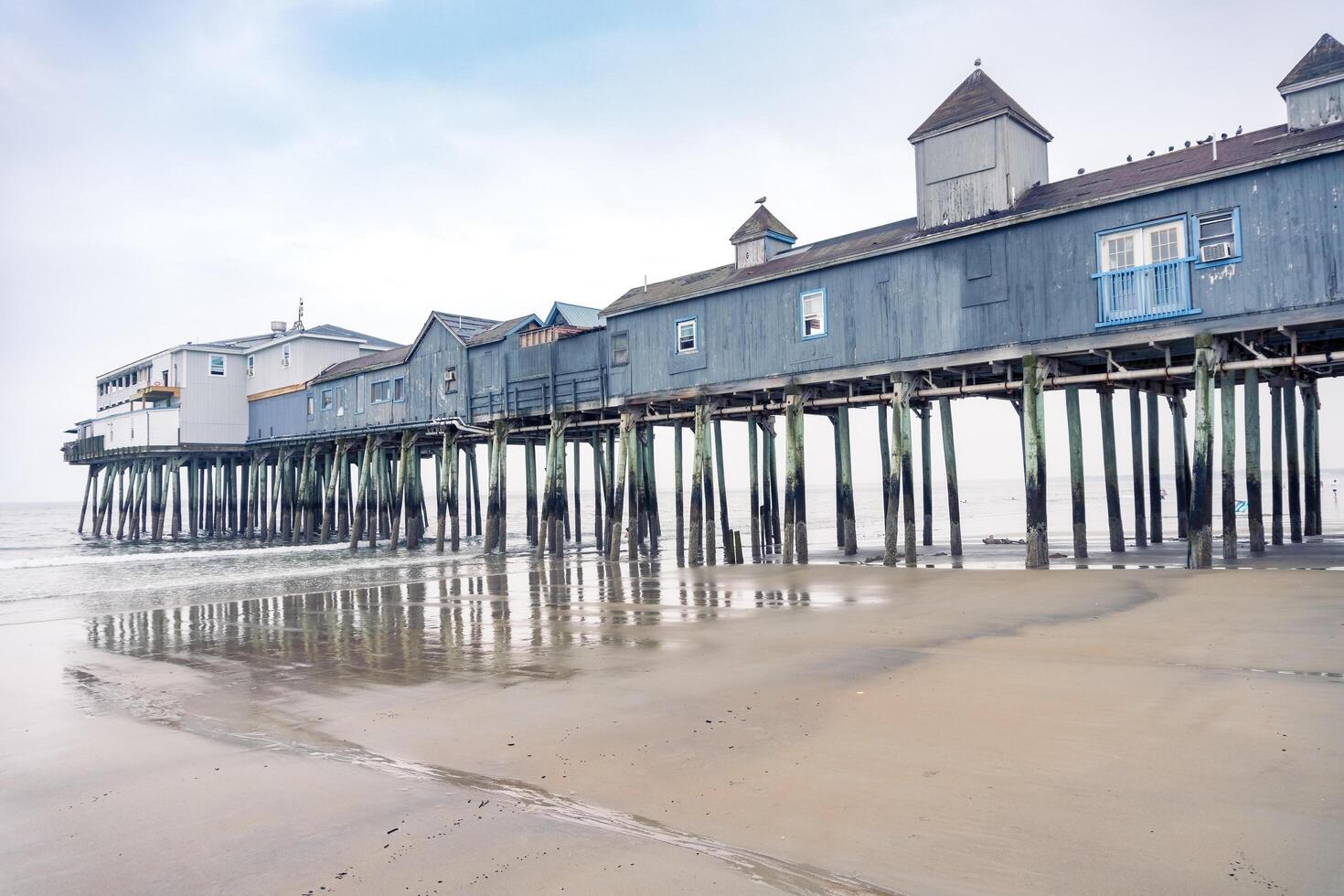 Boston, USA - August 13, 2019-view of the beach in Old Orchard Beach, a town in Massachusetts during a cloudy day photo