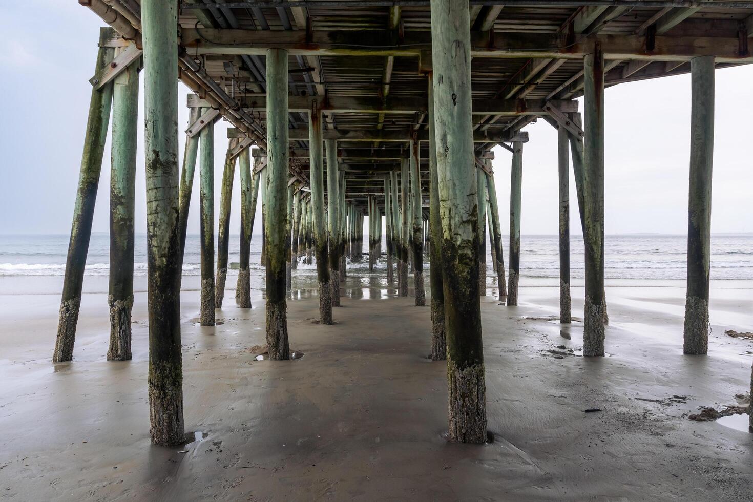 Boston, USA - August 13, 2019-view of the beach in Old Orchard Beach, a town in Massachusetts during a cloudy day photo