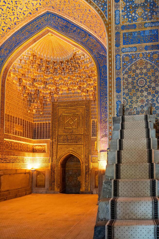 Samarkand, Uzbekistan-august 12, 2023-Interior of the Tilla-Kari Mosque in the Registan Square in Sammarkand during summer day photo