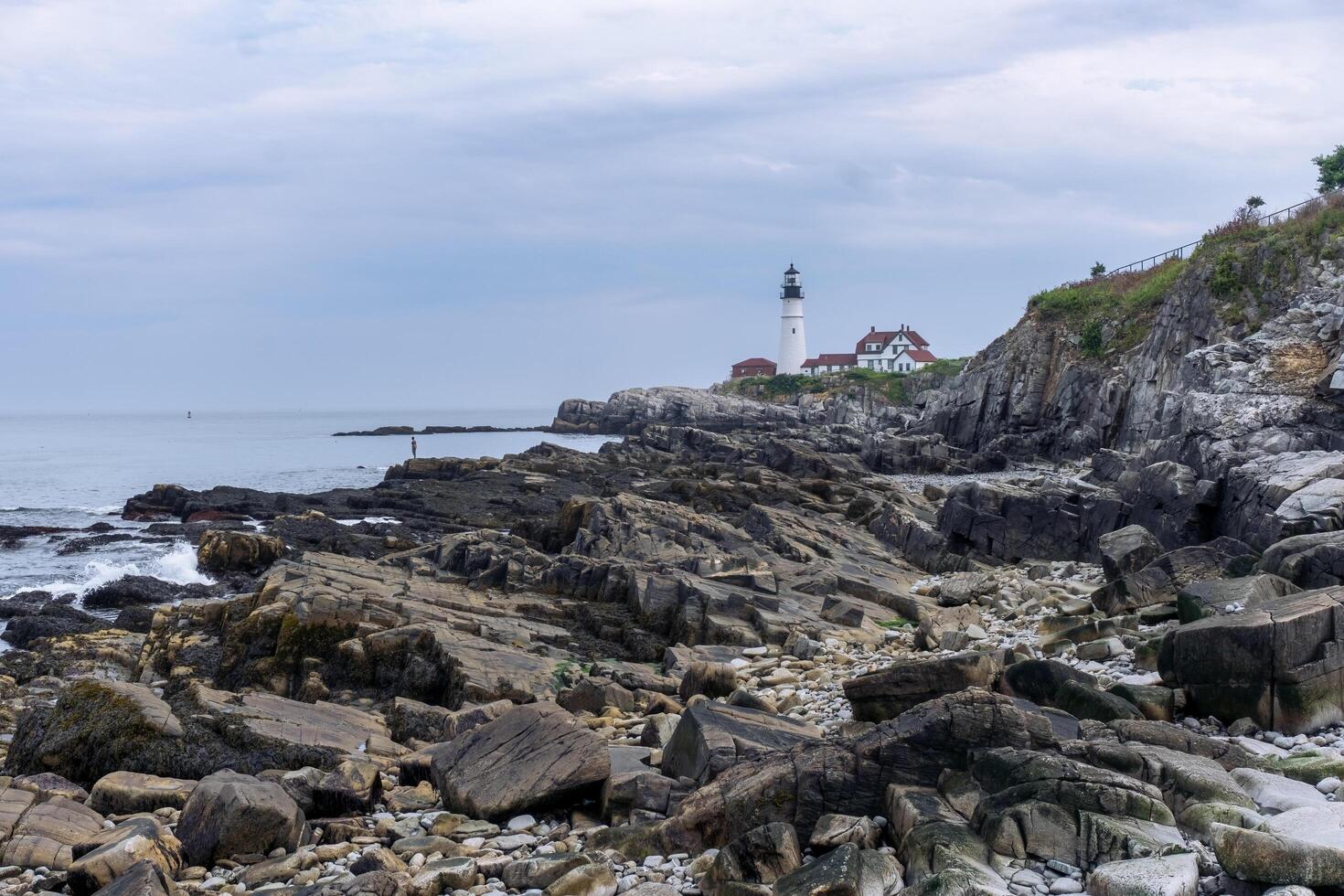 Portland, USA - August 13, 2019-view of the Portland Head Light a historic lighthouse in Cape Elizabeth, Maine during a cloudy day photo