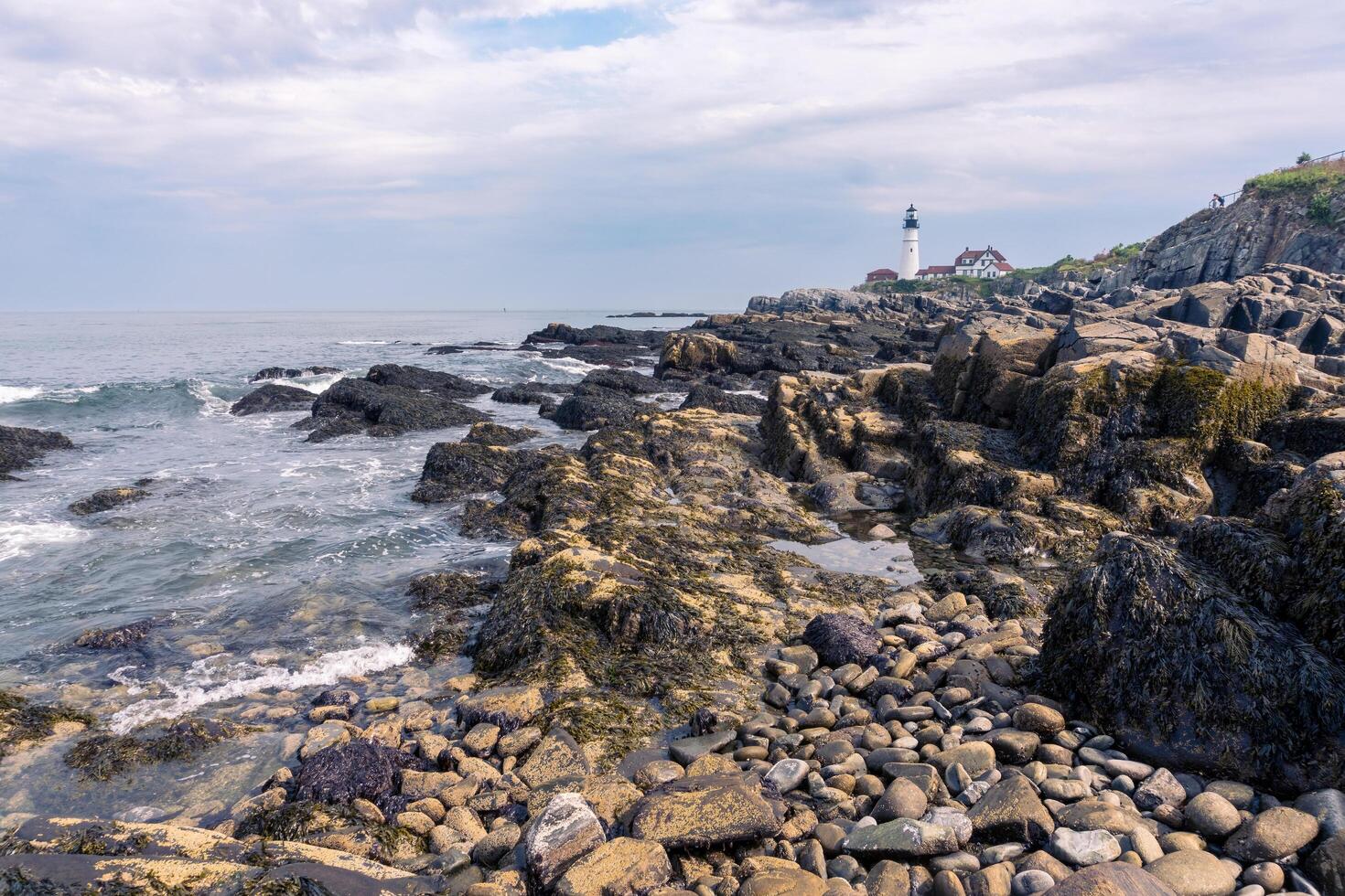 Portland, USA - August 13, 2019-view of the Portland Head Light a historic lighthouse in Cape Elizabeth, Maine during a cloudy day photo