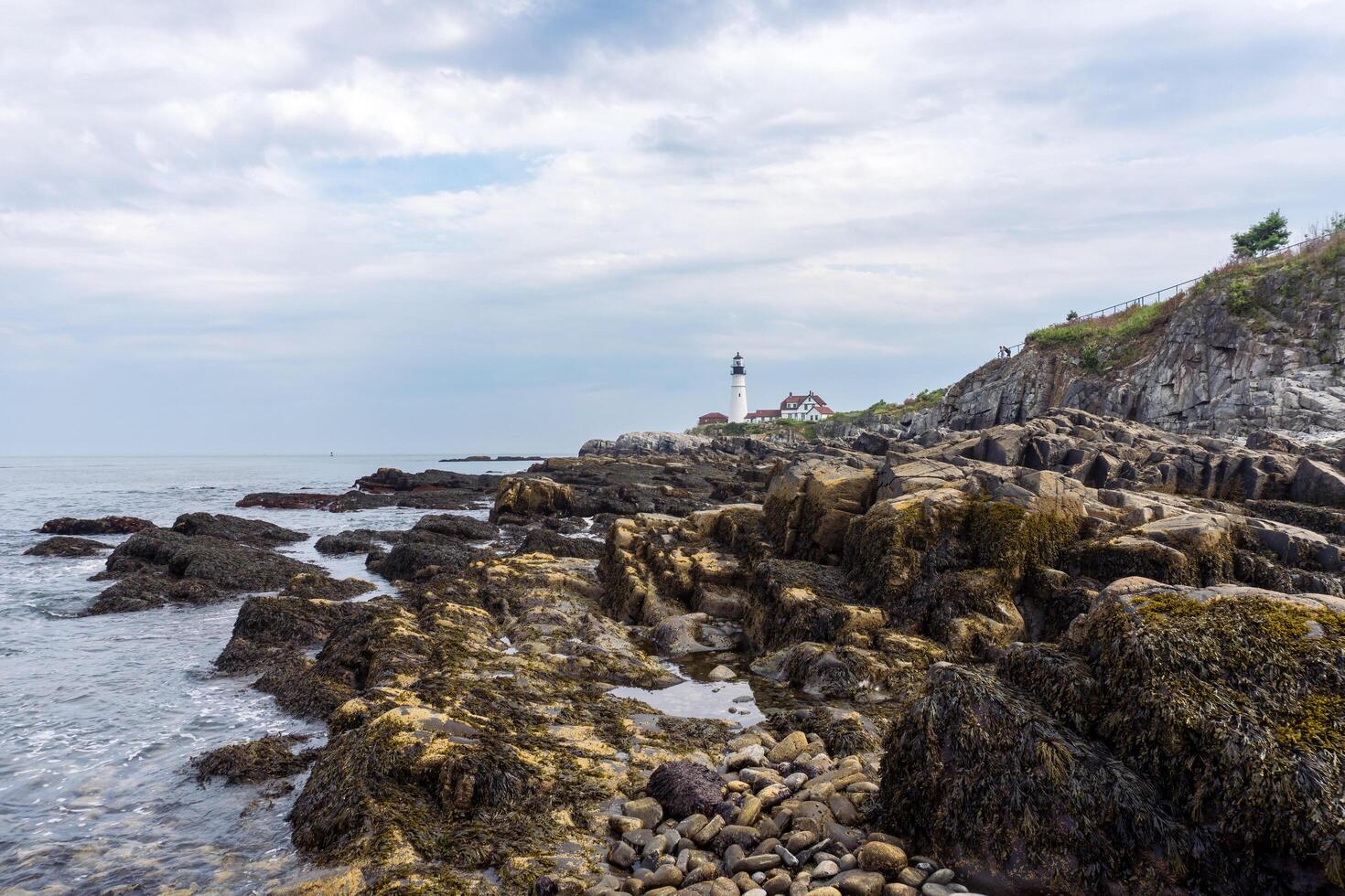 Portland, USA - August 13, 2019-view of the Portland Head Light a historic lighthouse in Cape Elizabeth, Maine during a cloudy day photo