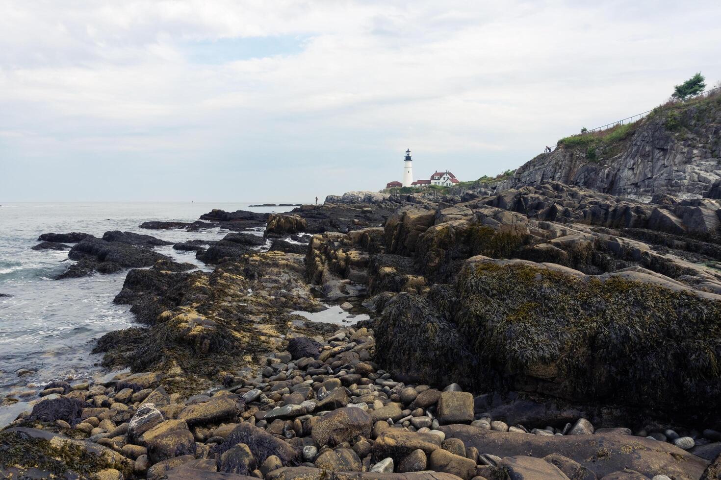 Portland, USA - August 13, 2019-view of the Portland Head Light a historic lighthouse in Cape Elizabeth, Maine during a cloudy day photo