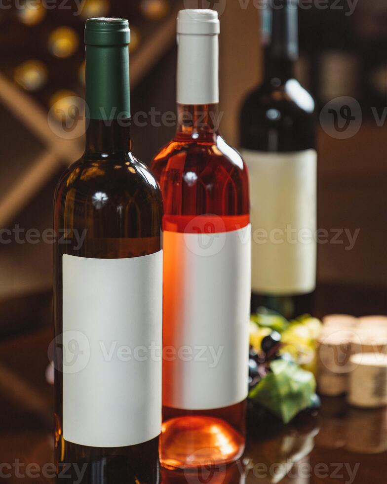 Wine bottles standing with blank labels for your brand photo
