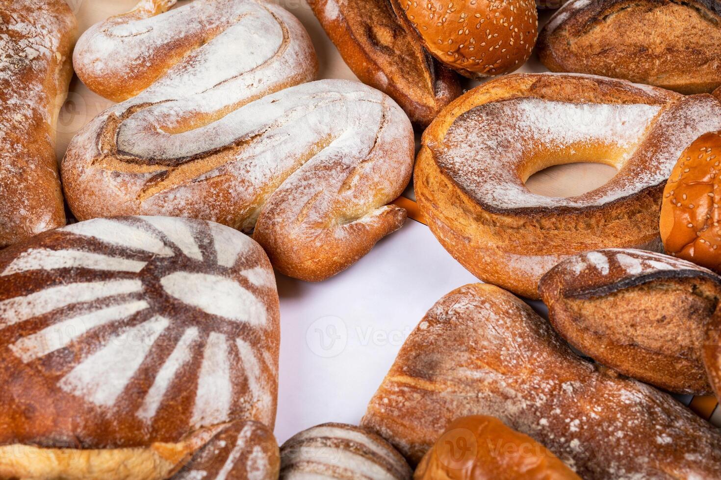 Tasty breads top view with empty center for logo photo