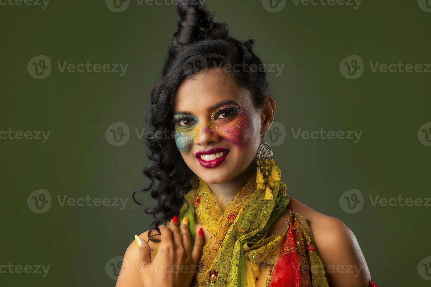 A gorgeous Young model beautiful woman or girl with perfect art creative makeup like a butterfly. photo