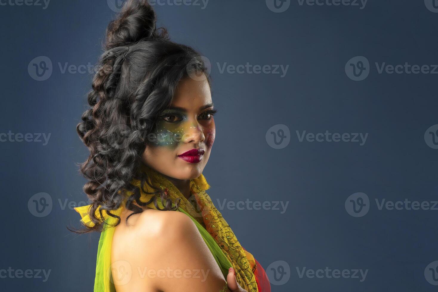 A gorgeous Young model beautiful woman or girl with perfect art creative makeup like a butterfly. photo