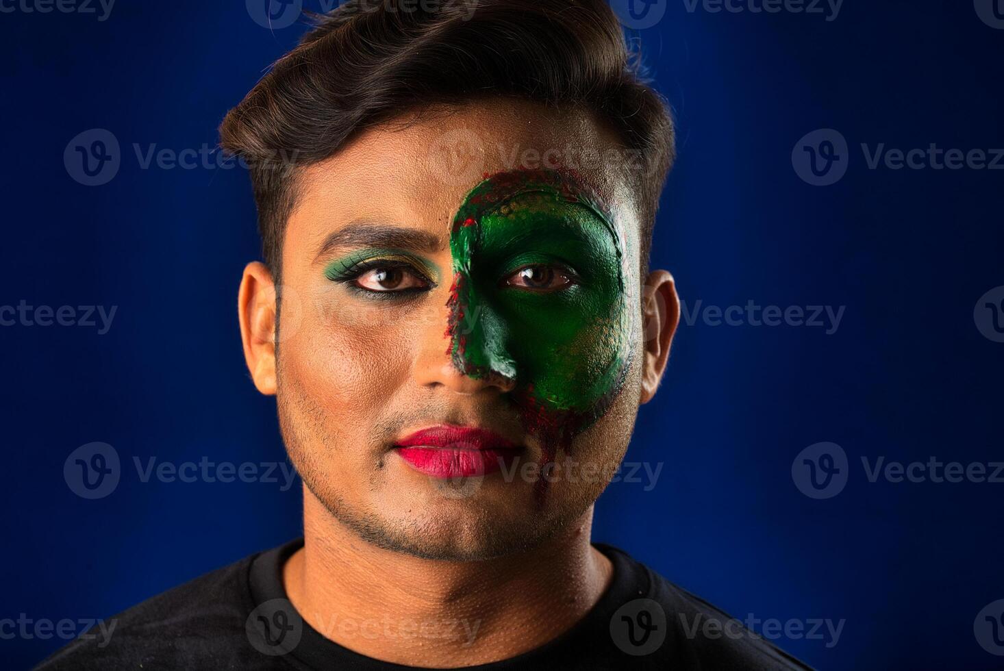A young man with art creative makeup on his face like a snake. Half face portrait with scary zombie makeup or Halloween face art. photo