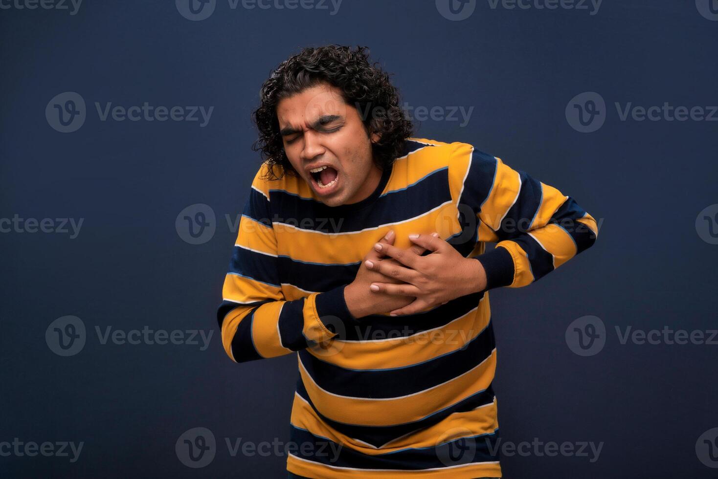 A man with his hands on his chest photo
