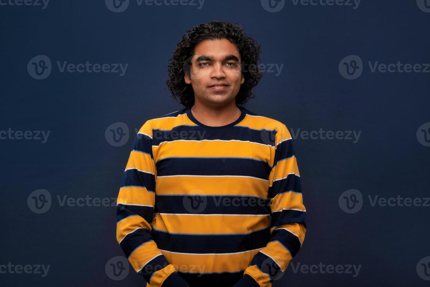 Portrait of happy young man on gray background. photo