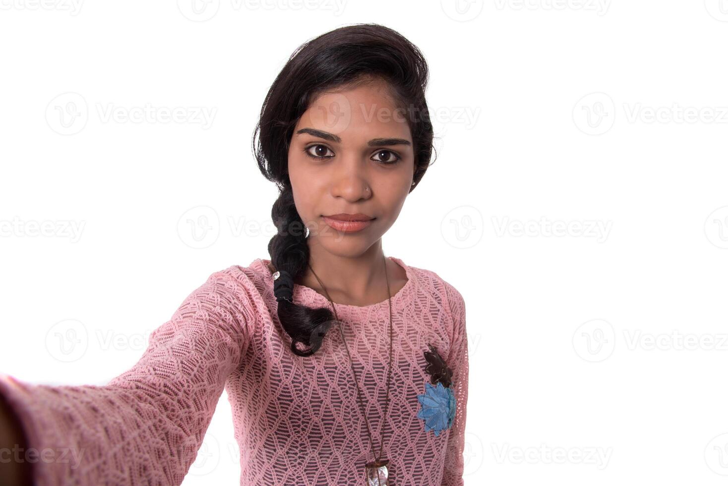 Young happy smile girl take selfie on white background photo