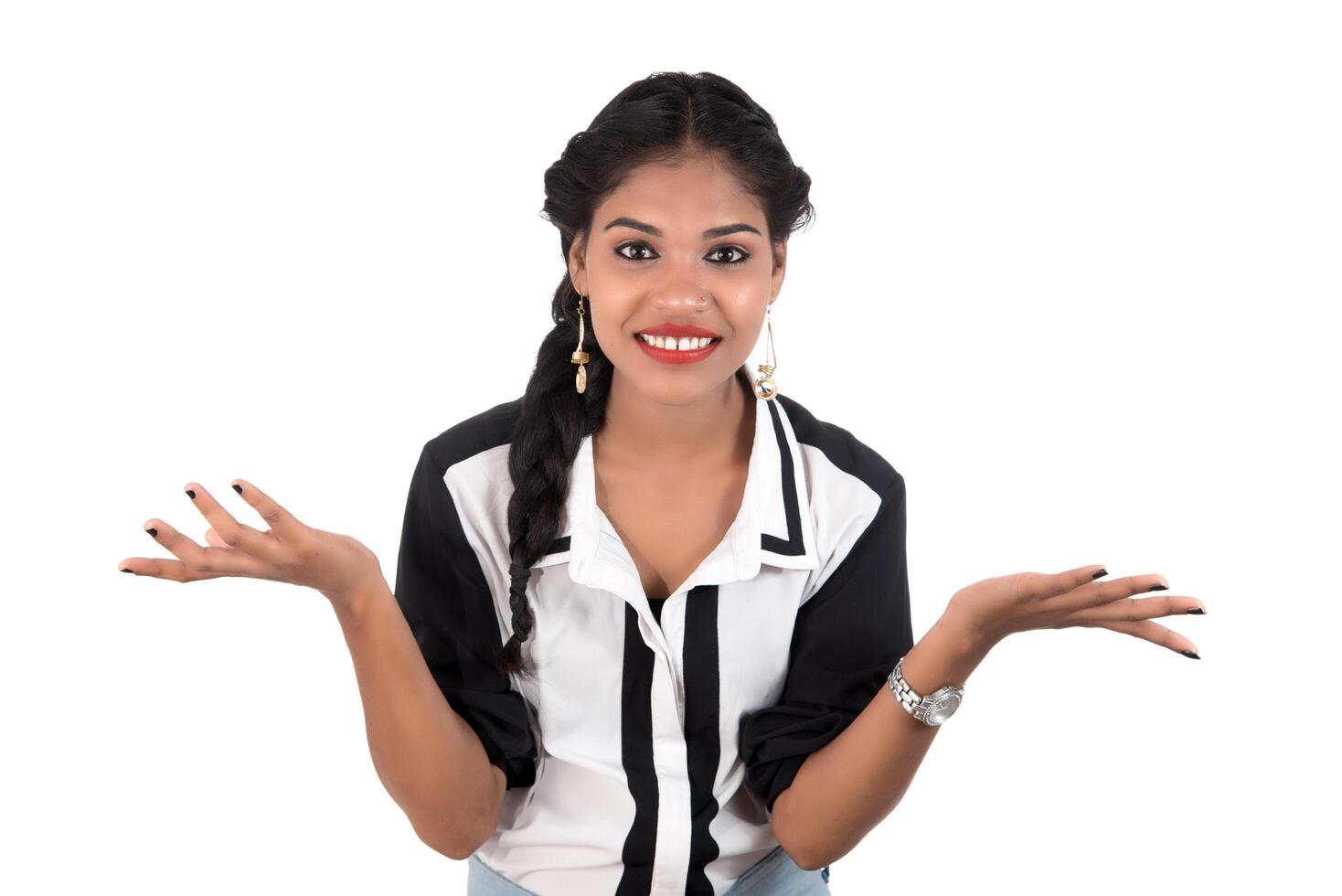 Portrait of beautiful young smiling girl posing on white background photo