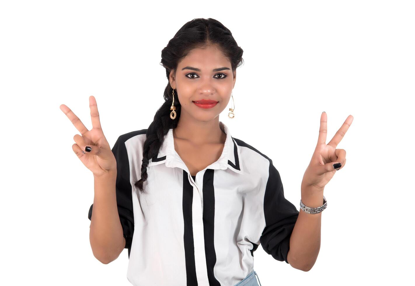 Portrait of beautiful young smiling girl posing on white background photo