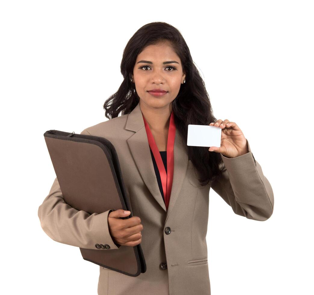 Smiling business woman holding a blank business card or ID card over white background photo
