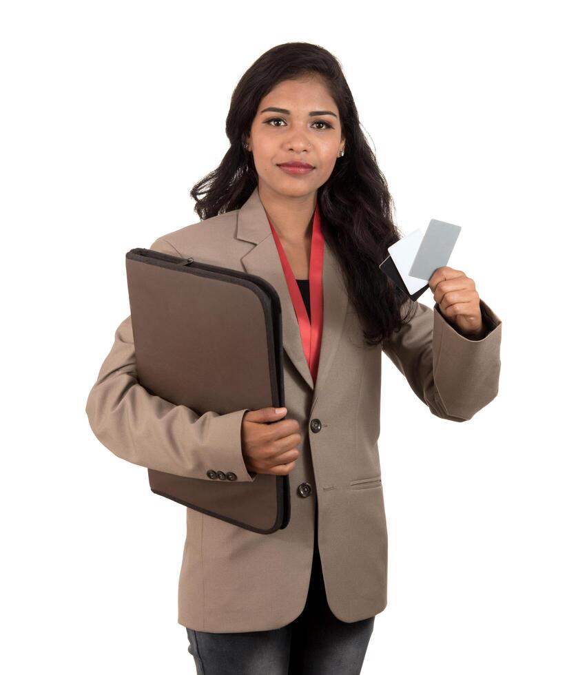 Smiling business woman holding a blank business card or ID card over white background photo