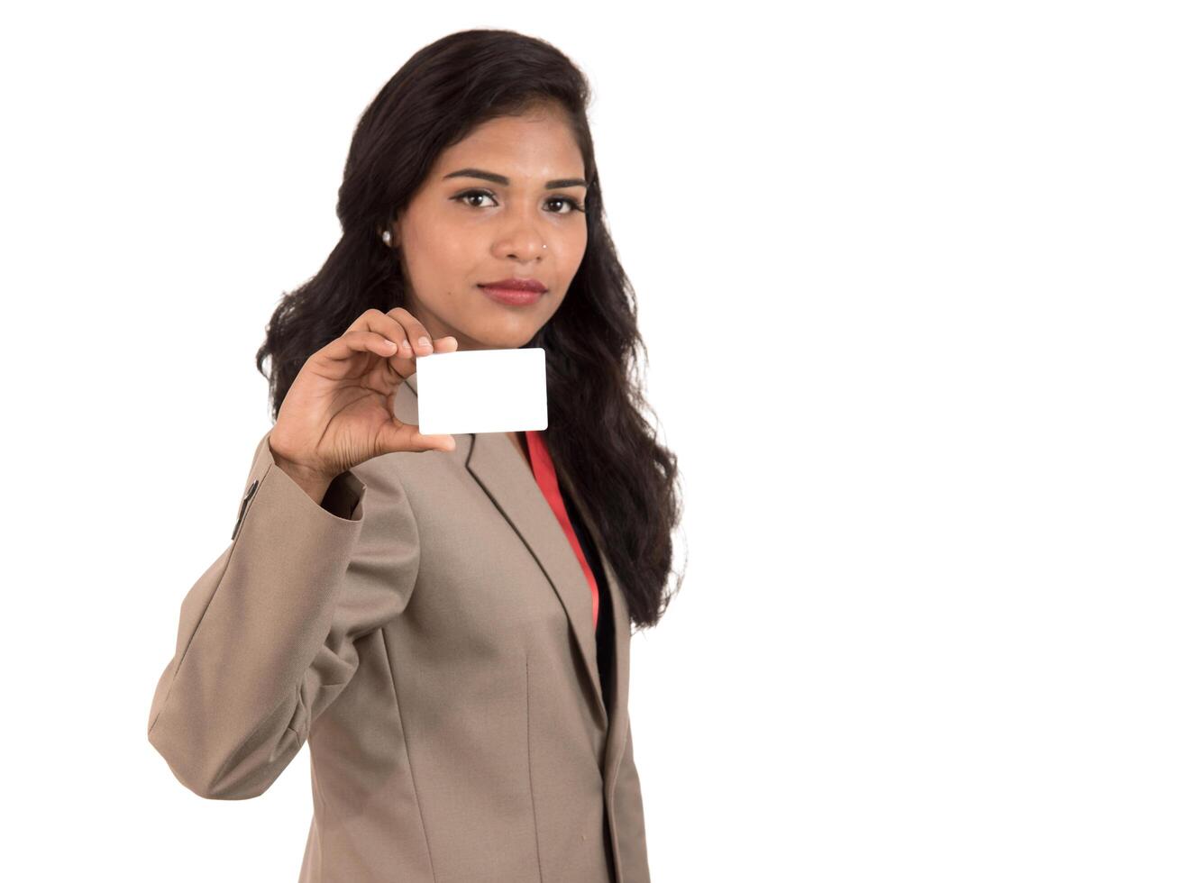 Smiling business woman holding a blank business card or ID card over white background photo