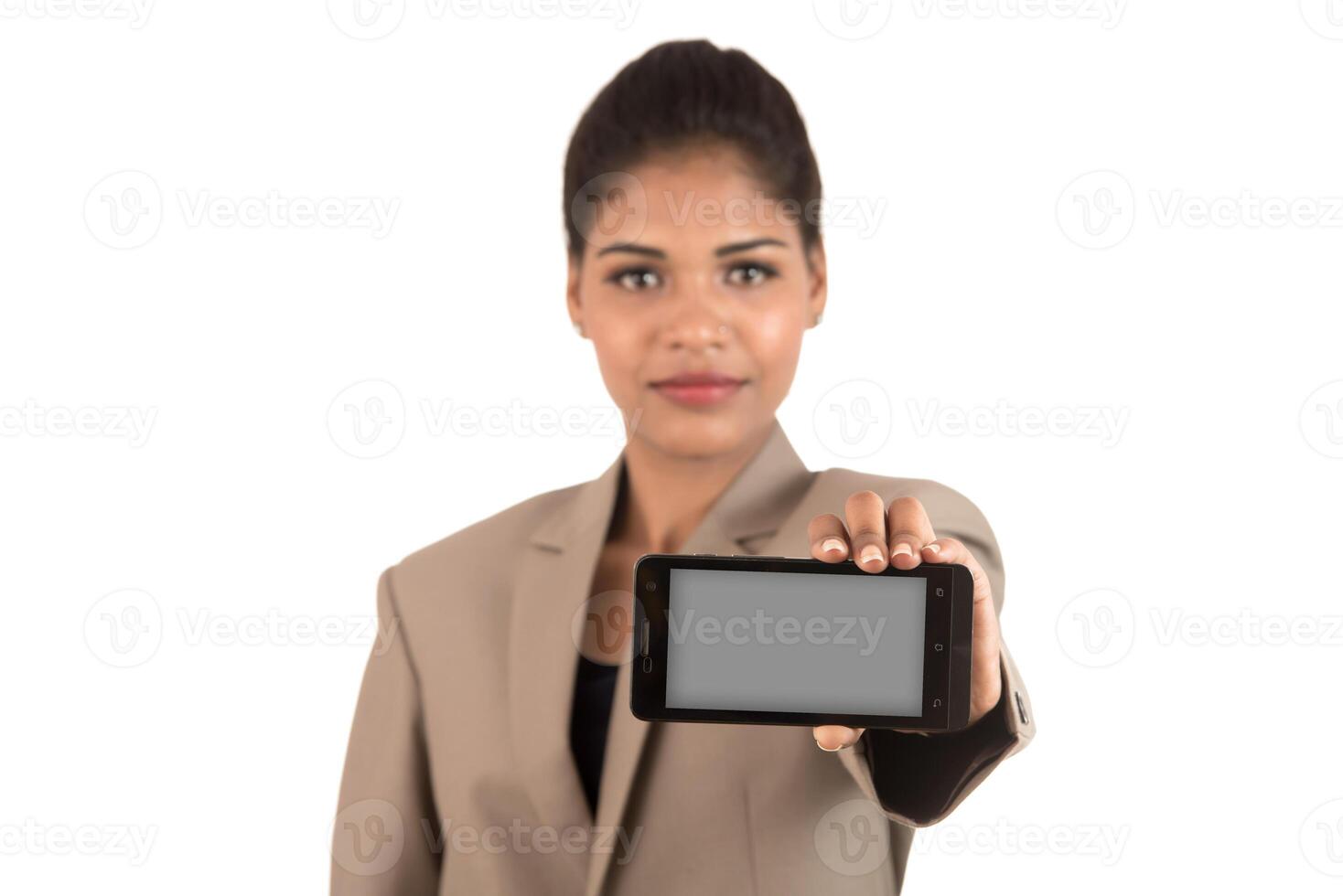 Young beautiful woman holding blank screen smart phone on white background photo