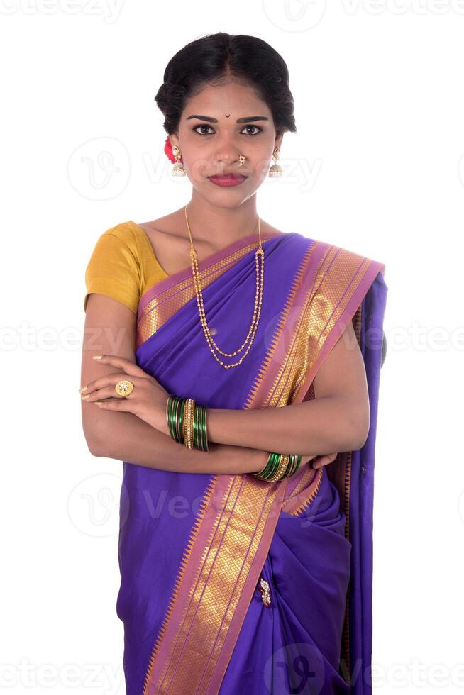 Beautiful Indian young girl posing in traditional Indian saree on white background. photo