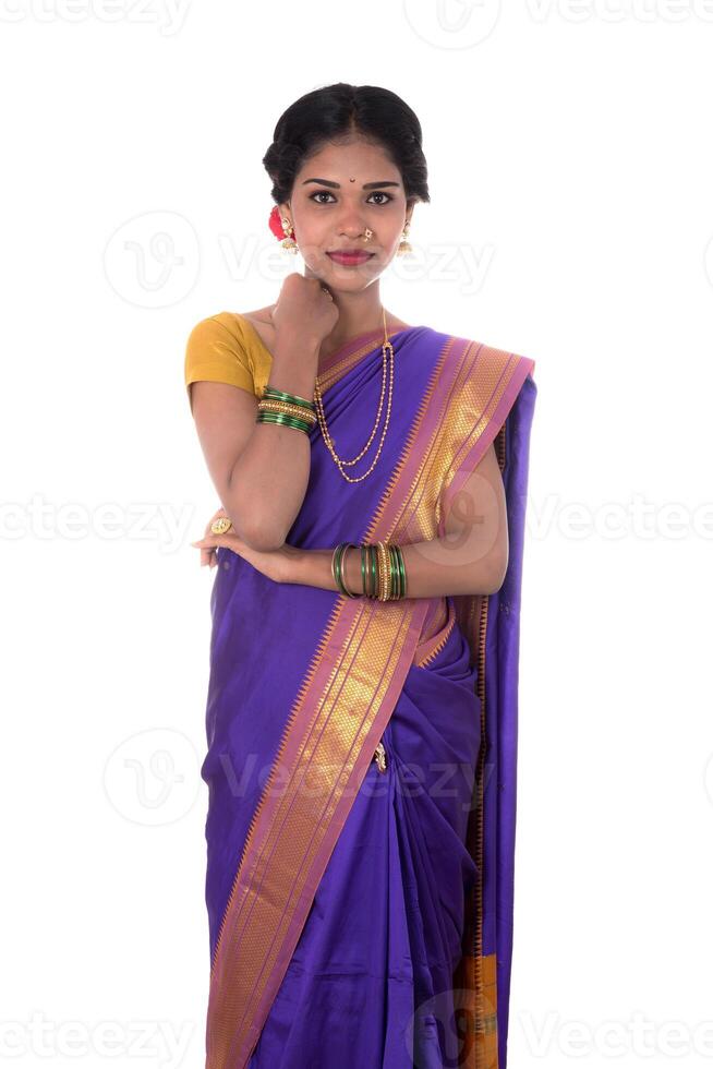 Beautiful Indian young girl posing in traditional Indian saree on white background. photo