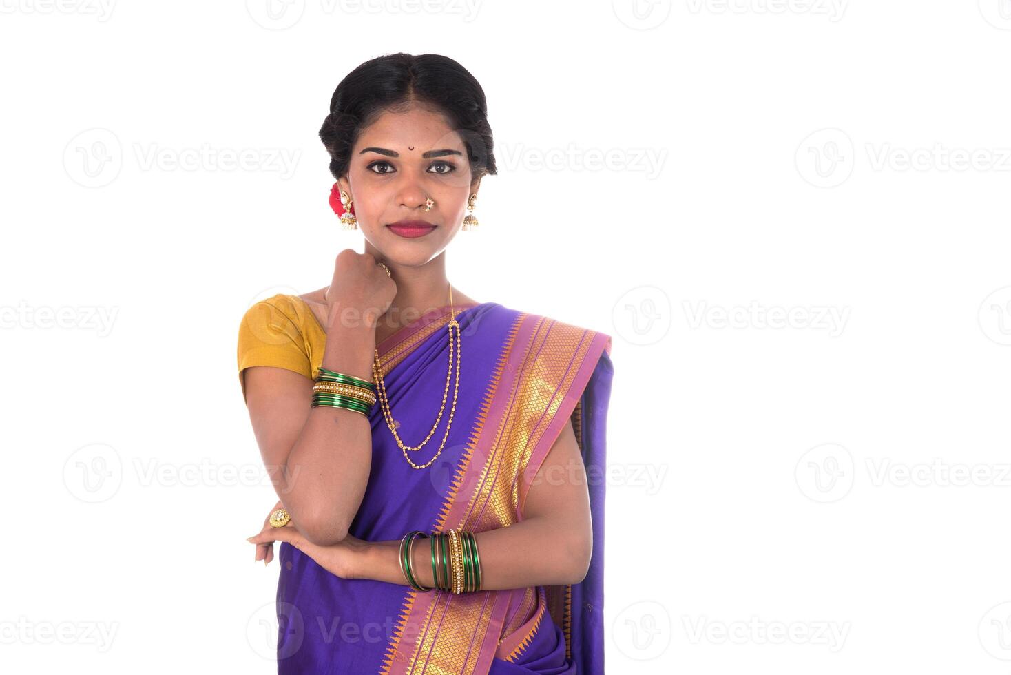 Beautiful Indian young girl posing in traditional Indian saree on white background. photo
