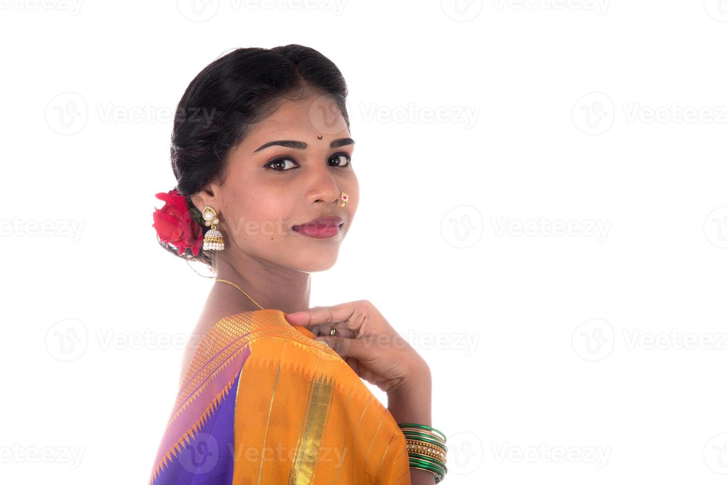 Beautiful Indian young girl posing in traditional Indian saree on white background. photo