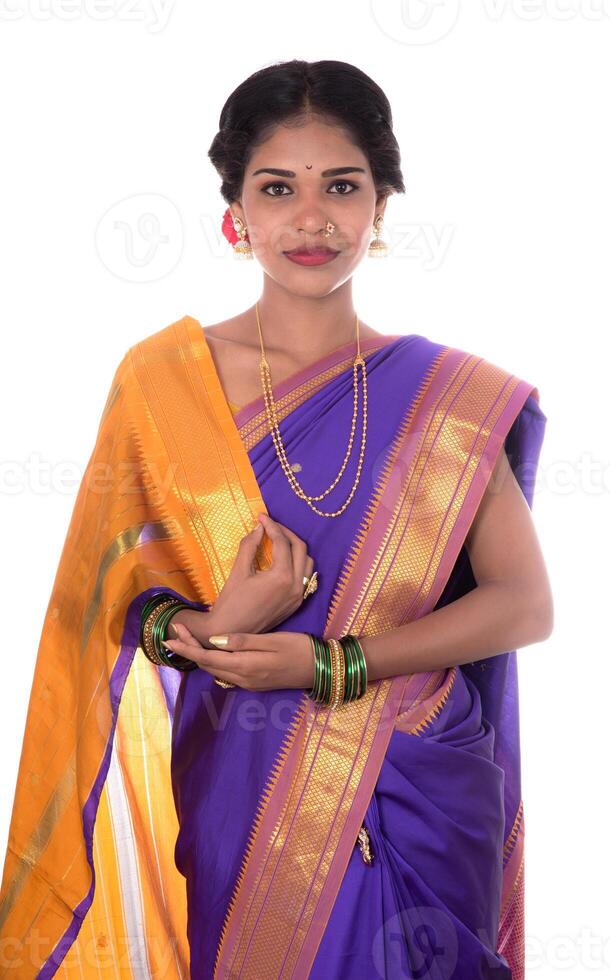 Beautiful Indian young girl posing in traditional Indian saree on white background. photo