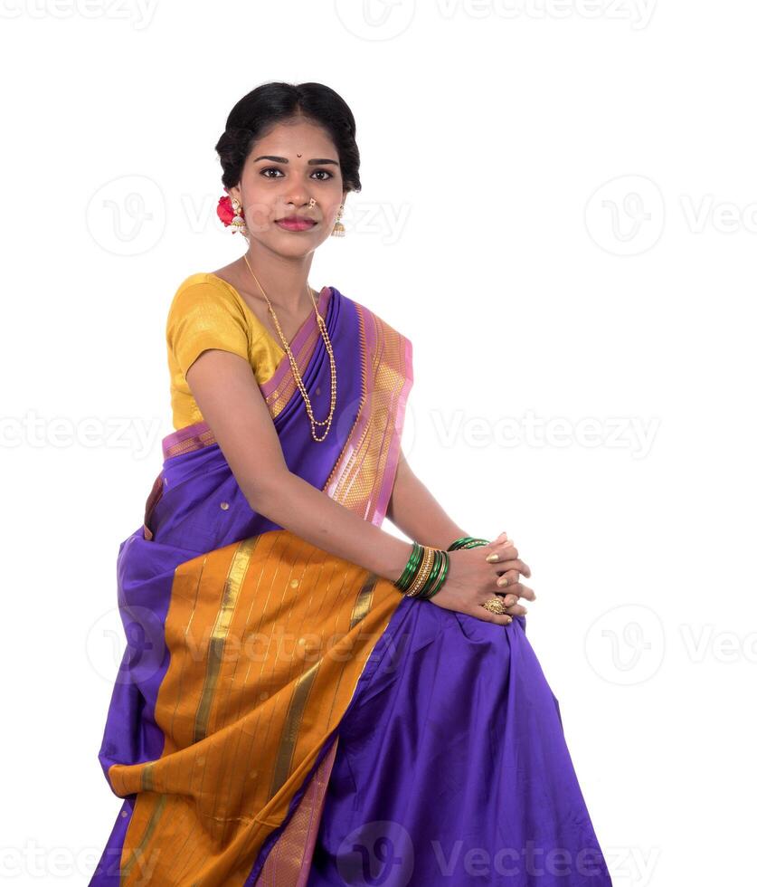 Beautiful Indian young girl posing in traditional Indian saree on white background. photo