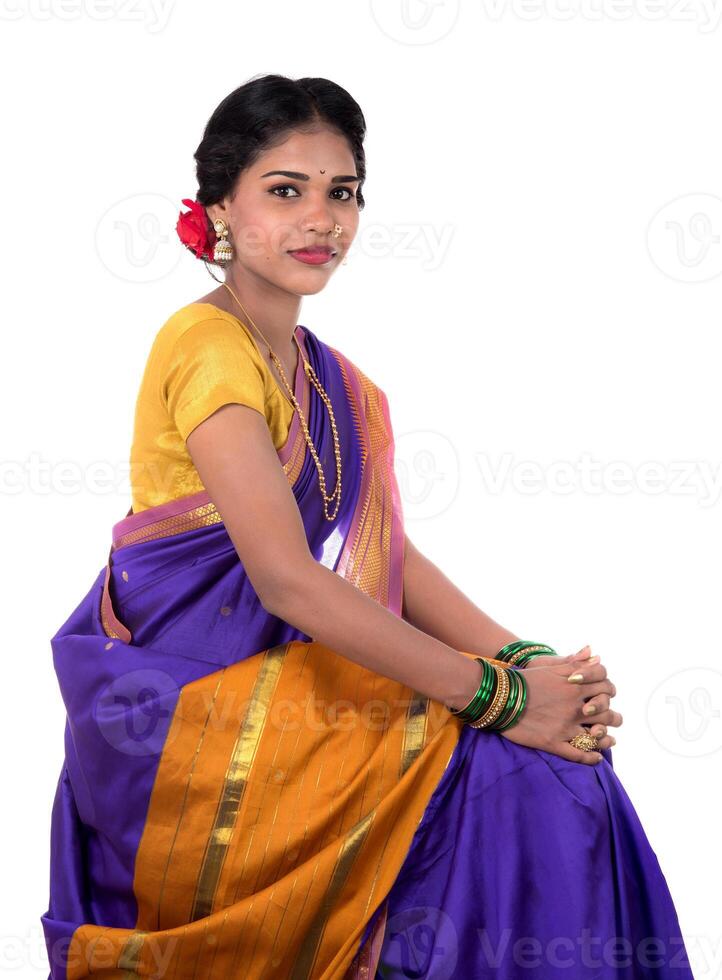 Beautiful Indian young girl posing in traditional Indian saree on white background. photo