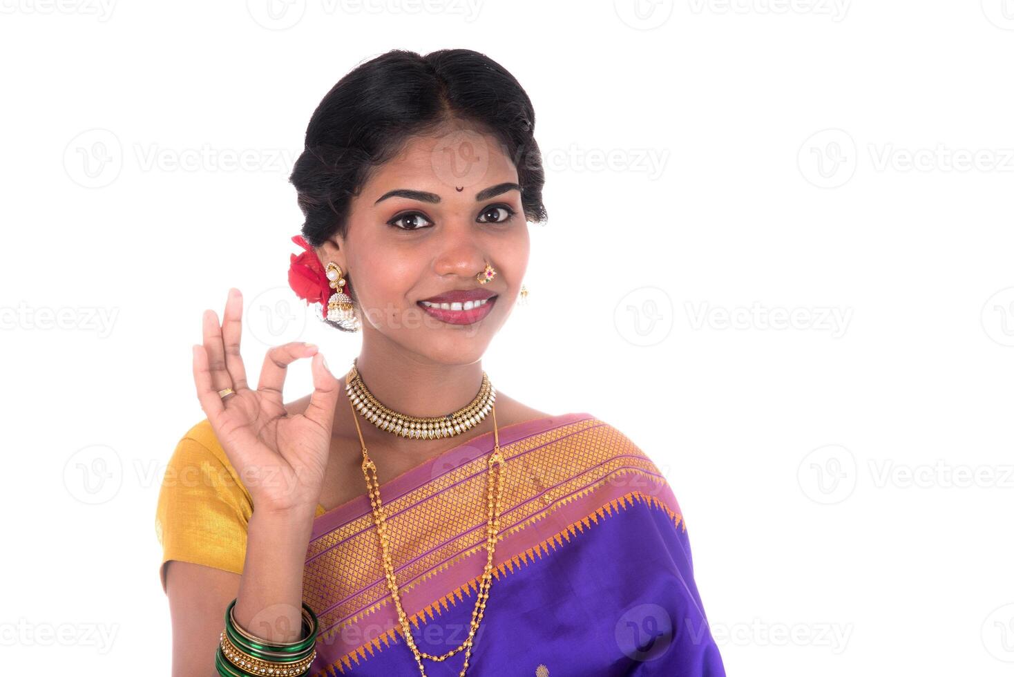 Beautiful Indian young girl posing in traditional Indian saree on white background. photo