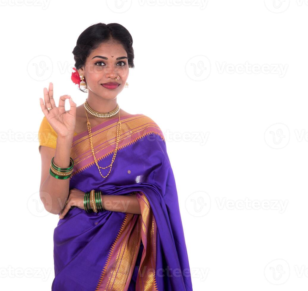 Beautiful Indian young girl posing in traditional Indian saree on white background. photo