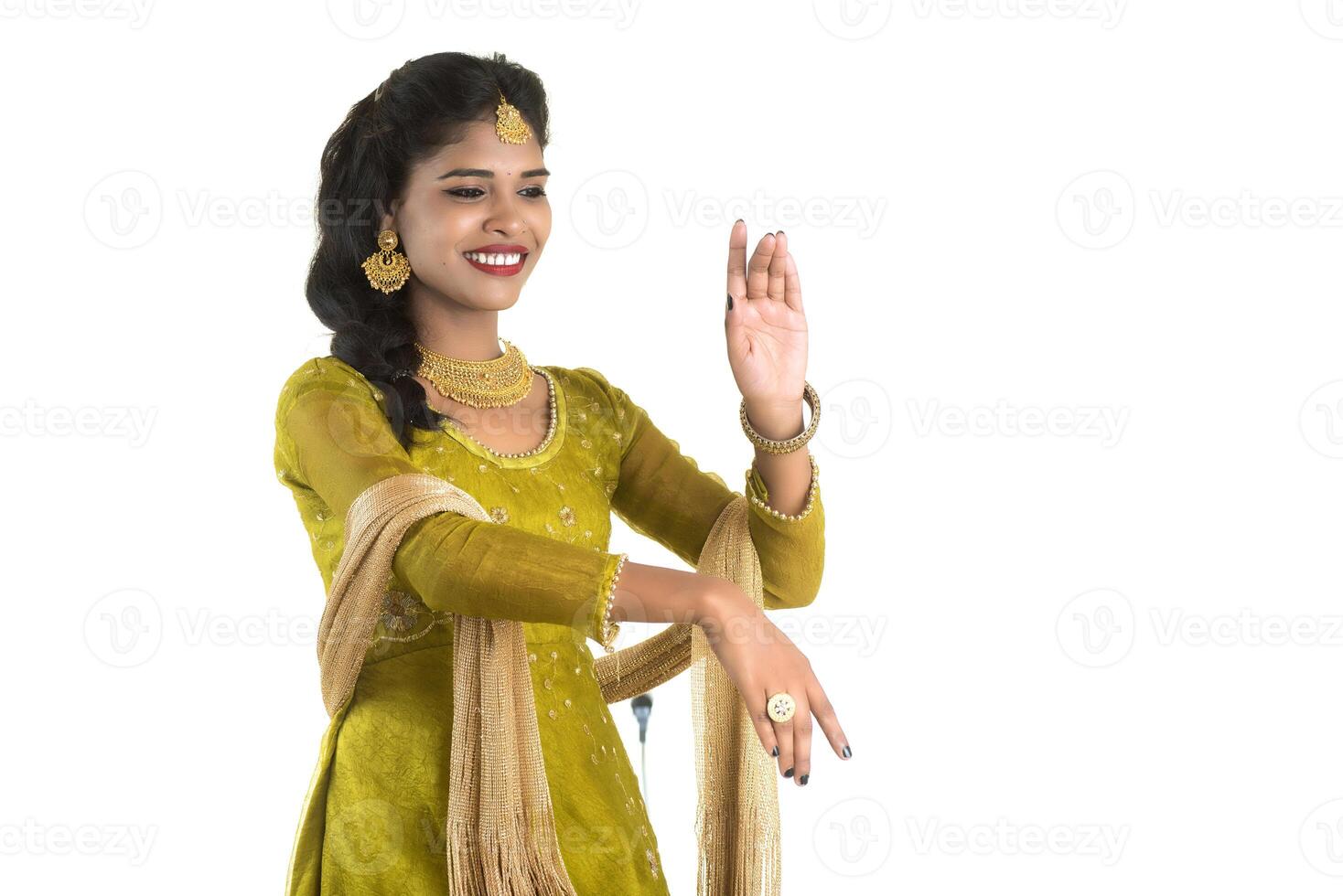 Smiling cheerful girl showing sign isolated on white background photo