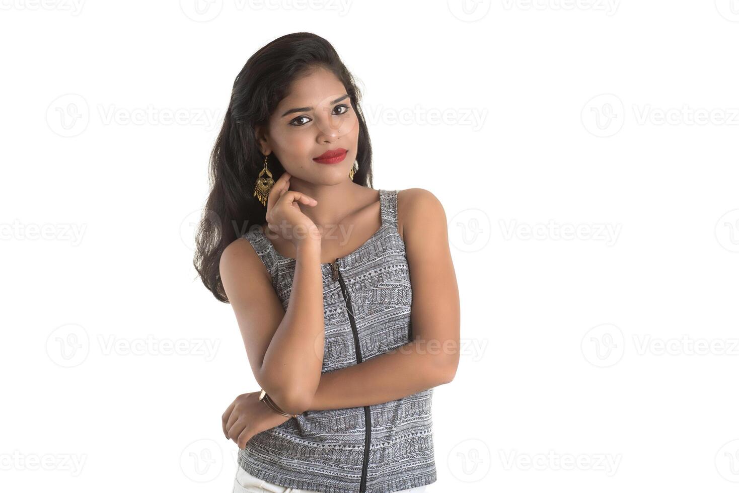 Portrait of beautiful young smiling girl posing on white background photo