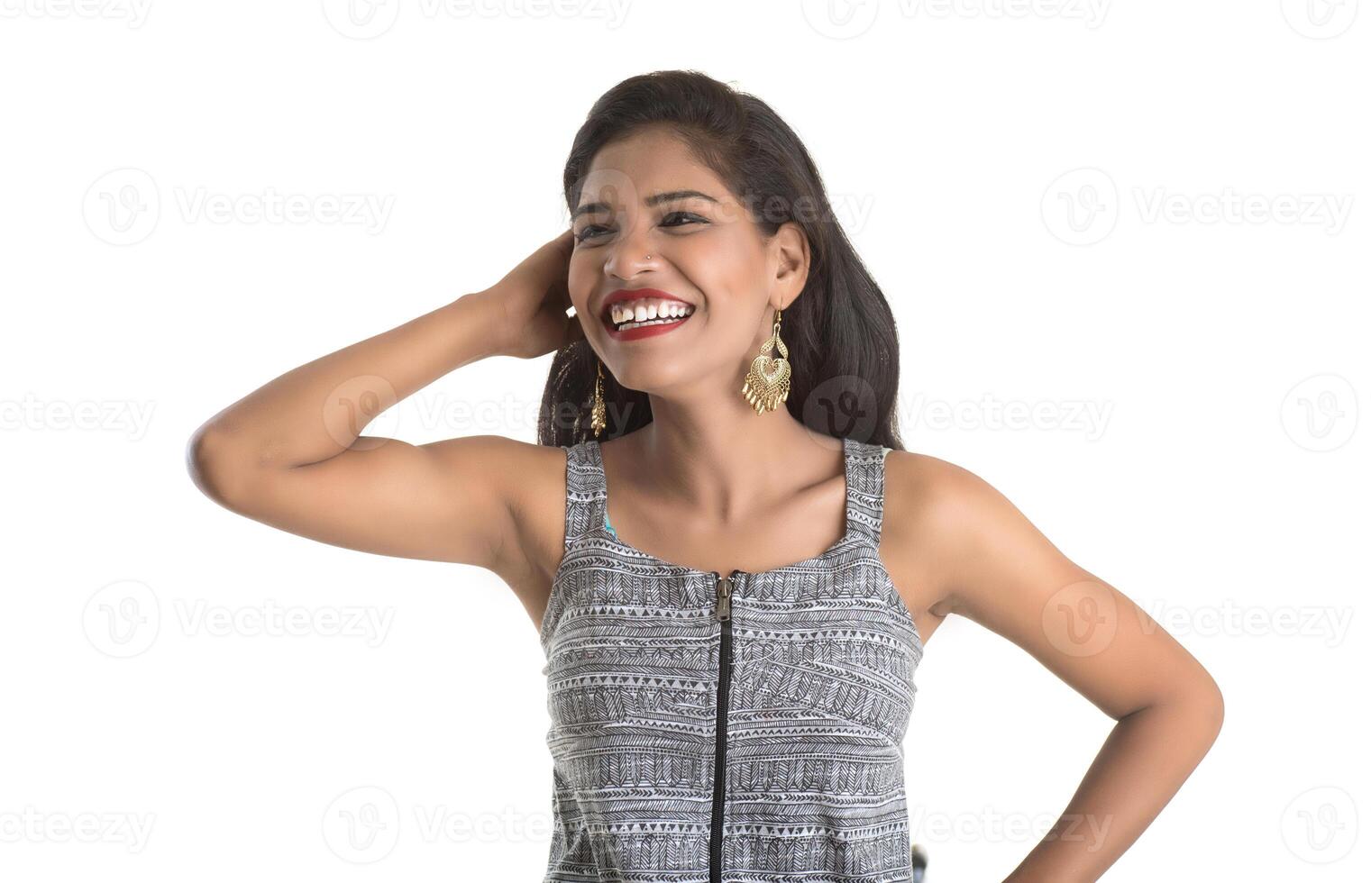 Portrait of beautiful young smiling girl posing on white background photo
