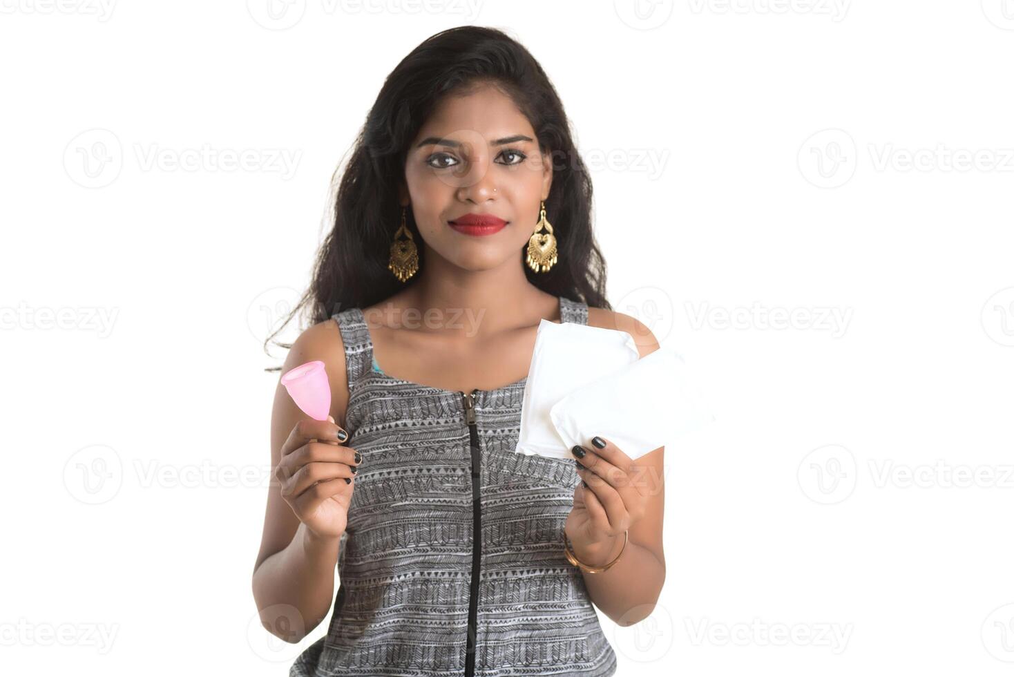 Close-up of young girl hands holding menstrual cup, Gynaecology concept, Showing thumbs up approving the use of the menstrual cup photo