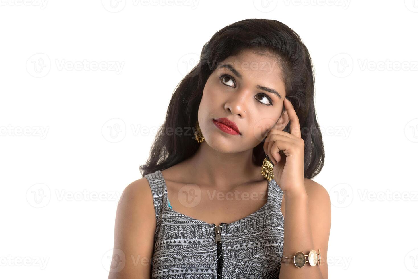 Smiling cheerful girl showing sign isolated on white background photo