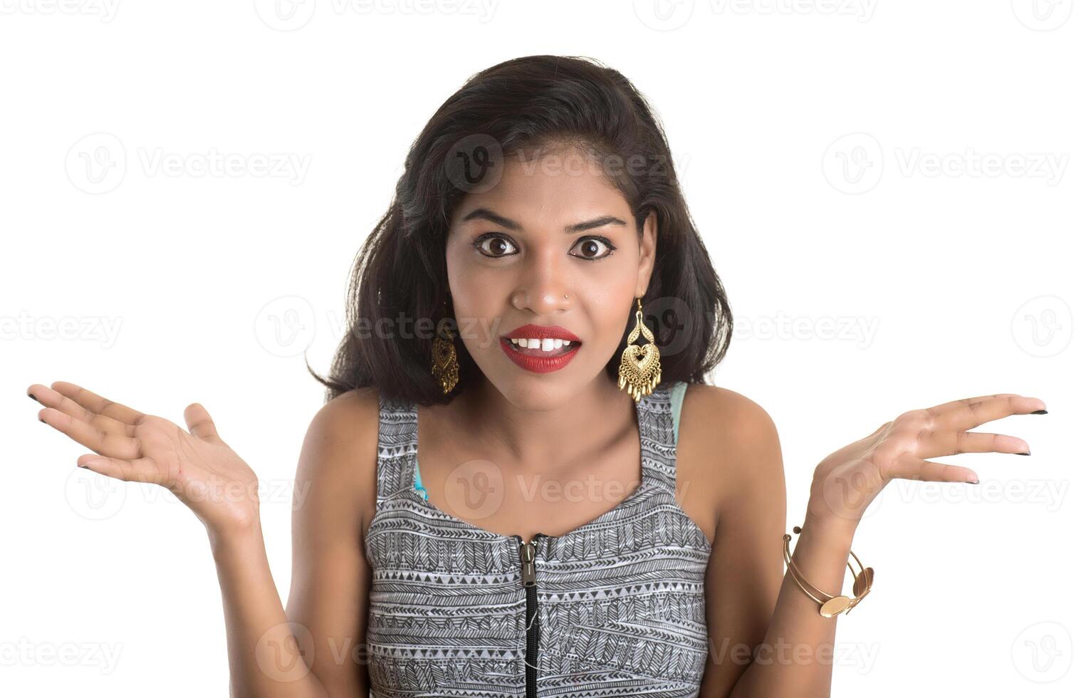 Smiling cheerful girl showing sign isolated on white background photo