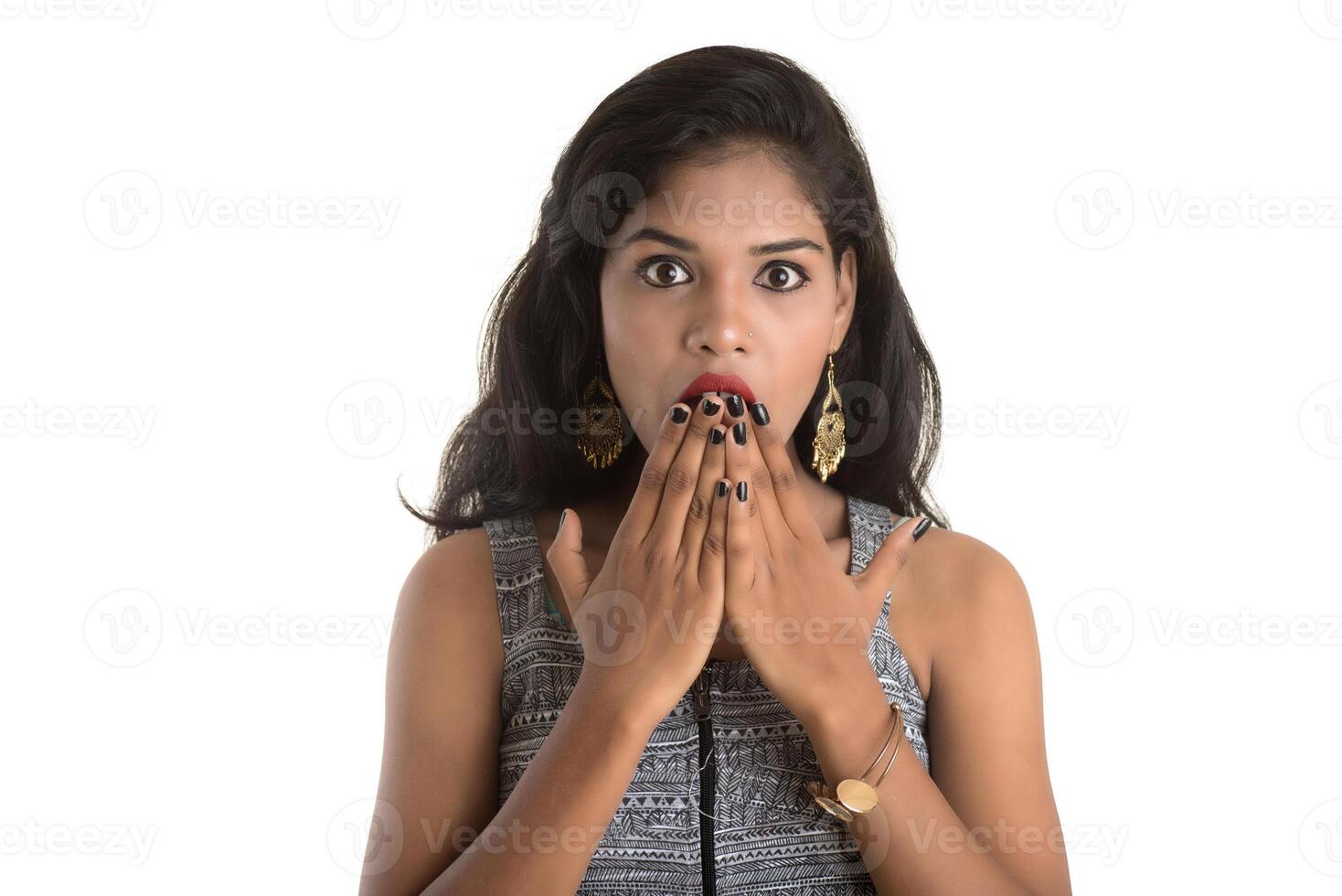 Smiling cheerful girl showing sign isolated on white background photo