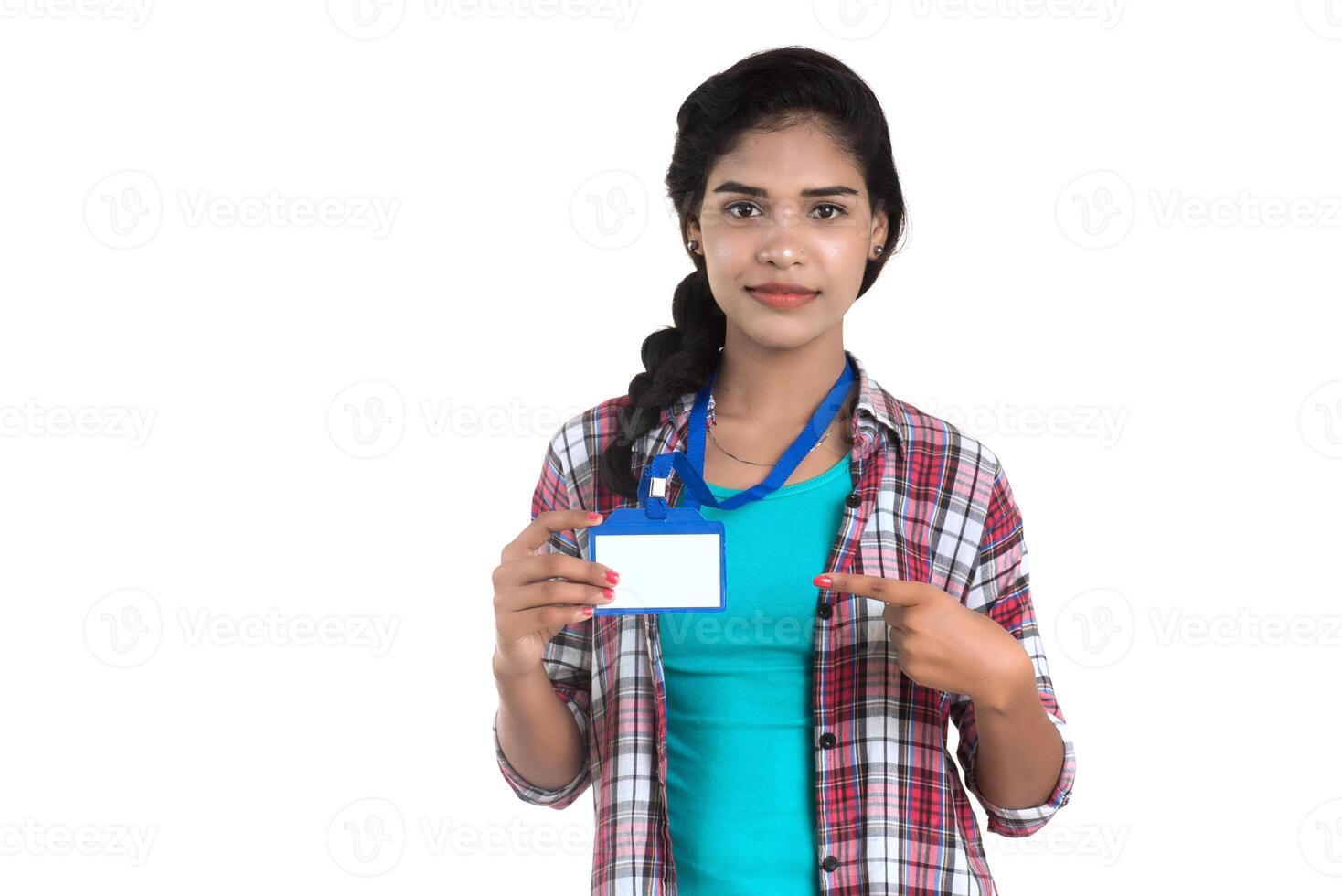 Young woman holding Identification white blank plastic id card. photo