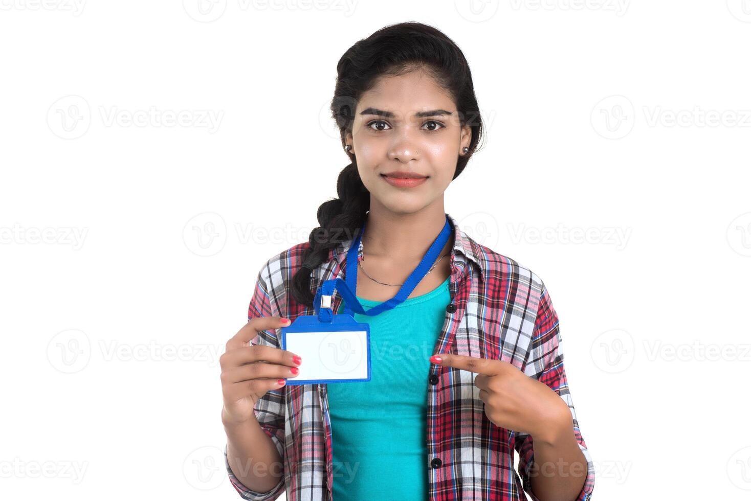 Young woman holding Identification white blank plastic id card. photo